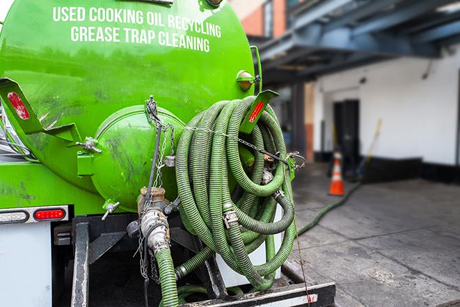 maintenance crew pumping grease trap at a fast food restaurant in Creve Coeur, MO